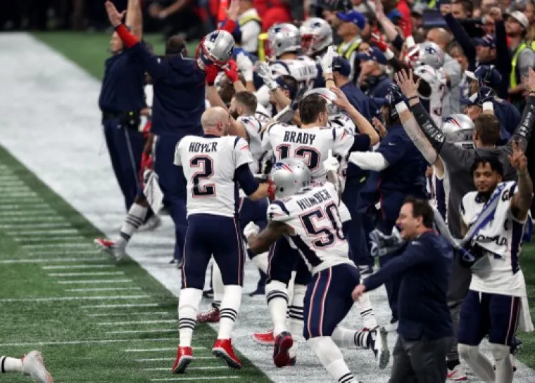 ATLANTA, - FEBRUARY 03: Tom Brady #12 of the New England Patriots celebrates with his team after their 13-3 win over the Los Angeles Rams during Super Bowl LIII at Mercedes-Benz Stadium on February 03, 2019 in Atlanta, Georgia.   Patrick Smith/Getty Images/AFP