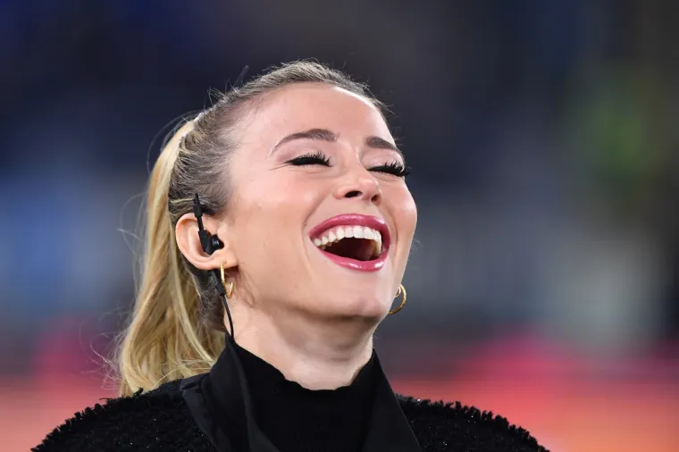 Italian television presenter Diletta Leotta laughs as she speaks from the pitch prior to the Italian Serie A football match lazio Rome vs Juventus Turin on December 7, 2019 at the Olympic stadium in Rome., Image: 486894224, License: Rights-managed, Restrictions: , Model Release: no, Credit line: Alberto PIZZOLI / AFP / Profimedia