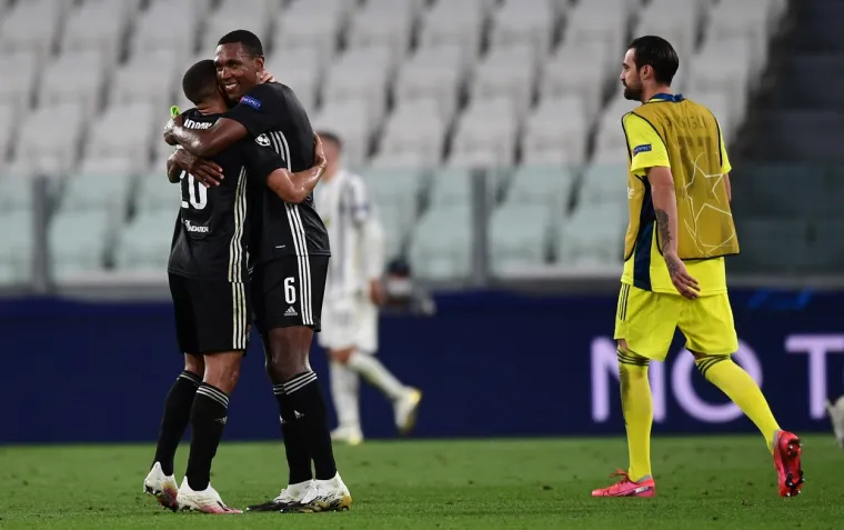 Lyon's Brazilian defender Marcal (L) celebrate with Lyon's Brazilian defender Marcelo after winning  the UEFA Champions League round of 16 second leg football match Juventus vs Olympique Lyonnais, played behind closed doors due to the spread of the COVID-19 infection, caused by the novel coronavirus, at the Juventus stadium, in Turin , on August 7, 2020.,Image: 550804859, License: Rights-managed, Restrictions: , Model Release: no