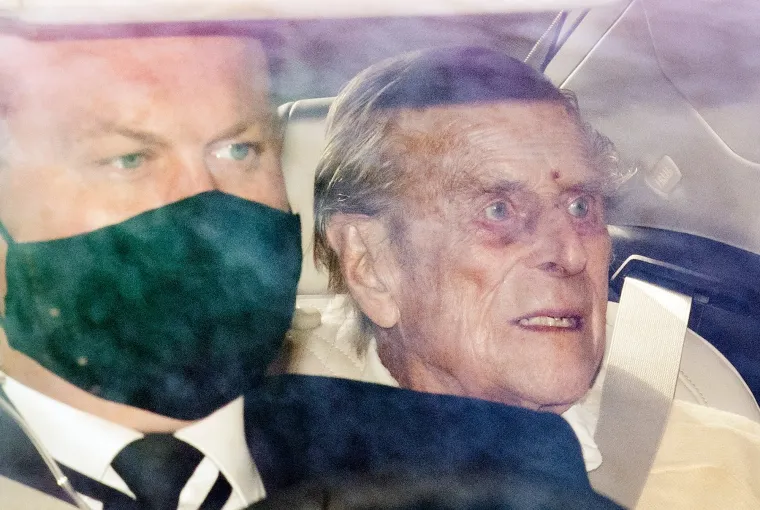 16/03/2021. London, UK. PRINCE PHILIP, THE DUKE OF EDINBURGH (right)  is driven from King Edward VII hospital in London. The Duke has spent a number of nights in hospital care after being admitted under doctors advice for an illness unrelated to COVID-19.,Image: 597929701, License: Rights-managed, Restrictions: *** UK Out ***, Model Release: no