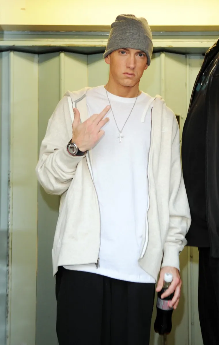 Eminemova majka Debbie tužila je njegovu školu 1982. godine jer ga je maltretirao domar D’Angelo Bailey. Eminem je kasnije o tome napisao pjesmu &quot;Brain Damage&quot;, a isti domar onda je tužio repera jer je, kako tvrdi, pjesma ozbiljno narušila njegov ugled. Domar je u intervjuima za medije priznao da je maltretirao Eminema te je sud odbacio njegove tužbe. Slavni reper imao je uvijek problema sa školom, a prvi razred srednje škole pao je tri puta prije nego što je potpuno odustao.
