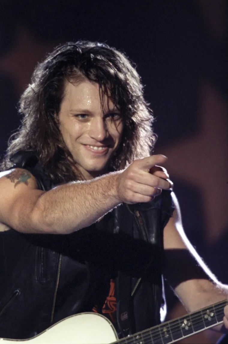 Jon Bon Jovi počeo je izvoditi glazbu uživo 1975., u dobi od 13 godina, svirajući klavir i gitaru sa svojim prvim bendom &apos;Raze&apos;. Sa 16 godina, Jon je upoznao Davida Bryana i osnovao bend pod nazivom &apos;Atlantic City Expressway&apos;. Još u tinejdžerskim godinama, Bon Jovi je svirao u bendu &apos;John Bongiovi and the Wild Ones&apos;. Godine 1980., Jon je snimio svoj prvi singl &apos;Runaway&apos; u studiju svog rođaka, uz podršku studijskih glazbenika. Pjesmu je puštala lokalna radio postaja na kompilacijskoj vrpci. Godine 1983. Jon je posjetio lokalnu radio stanicu u New Yorku, kako bi napisao i otpjevao džinglove za postaju. Razgovarao je s DJ-em i direktorom promocije koji je predložio Jonu da uvrsti pjesmu &apos;Runaway&apos; na  album. Pjesma se počela emitirati na području New Yorka, a zatim su je preuzele i druge sestrinske postaje na velikim tržištima. U ožujku 1983. Bon Jovi je nazvao Davida Bryana, koji je zauzvrat pozvao basistu Aleca Johna Sucha i iskusnog bubnjara po imenu Tico Torres. Bon Jovijev prijatelj i susjed, Dave Sabo pozvan je da svira glavnu gitaru za kratku turneju uz &apos;Runaway&apos;, iako se nikada službeno nije pridružio bendu. On i Jon obećali su jedno drugome da će onaj tko to prvi napravi, pomoći drugome. Sabo je kasnije osnovao grupu Skid Row. Jon je vidio i bio impresioniran gitaristom iz rodnog grada Richiejem Samborom kojeg su preporučili njegov kolega basist Alec John Such i bubnjar Tico Torres. 