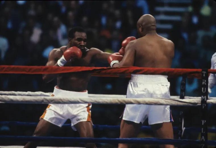 Foreman je do meča s Holifyeldom imao savršen skor od 24-0, od toga 23 nokauta. Taj meč dogodio se 19. travnja 1991. Holifyeld je dobio nakon 12 rundi velike borbe. 