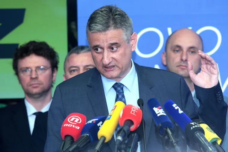 Lica HDZ-ovih ministara koji su stajali iza Karamarka na presici govore više od tisuću riječi