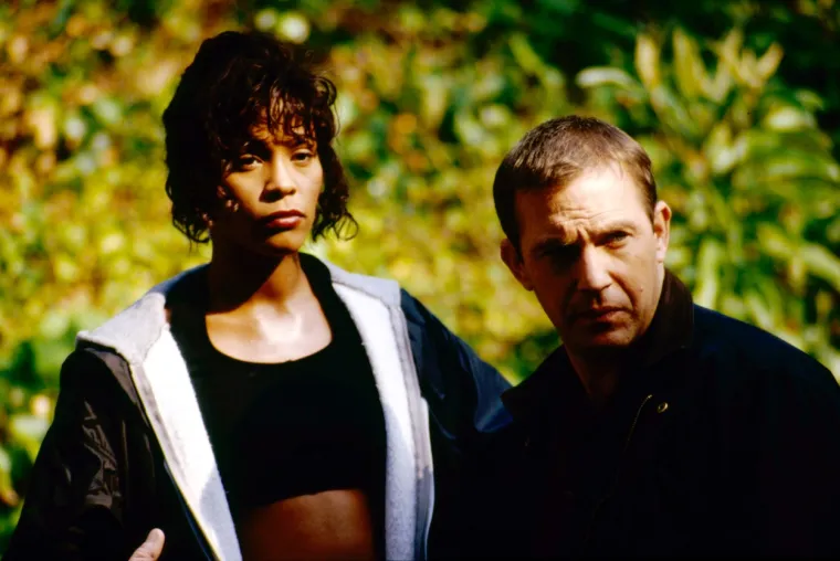 Nakon dva manja glumačka iskustva u serijama, iz 80-ih &quot;Gimme a Break!&quot; i &quot;Srebrne žlice&quot;, Houston je postala punopravna filmska zvijezda s Kevinom Costnerom u filmu &quot;The Bodyguard&quot; iz 1992. godine. Film je zaradio 410 milijuna dolara širom svijeta, a njegov soundtrack, koji uključuje &quot;I&apos;m Every Woman&quot;, &quot;I Have Nothing&quot;, &quot;Run to You&quot; i &quot;I Will Always Love You&quot;, postao je najprodavaniji soundtrack svih vremena. 