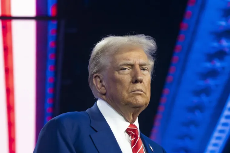 PHOENIX, ARIZONA - DECEMBER 22: U.S. President-elect Donald Trump looks on during Turning Point USA's AmericaFest at the Phoenix Convention Center on December 22, 2024 in Phoenix, Arizona. The annual four day conference geared toward energizing and connecting conservative youth hosts some of the country's leading conservative politicians and activists.  Rebecca Noble,Image: 949353838, License: Rights-managed, Restrictions:, Model Release: no