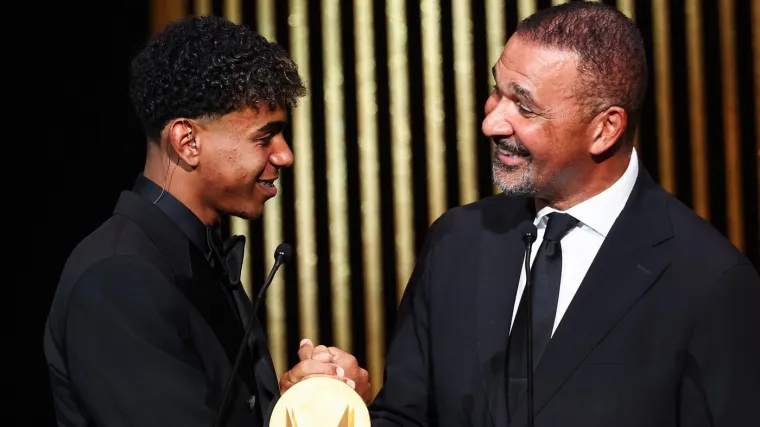 Former Dutch football player Ruud Gullit (R) gives the Kopa Trophy for best under-21 player to Barcelona's Spanish forward Lamine Yamal during the 2024 Ballon d'Or France Football award ceremony at the Theatre du Chatelet in Paris on October 28, 2024.,Image: 927513659, License: Rights-managed, Restrictions:, Model Release: no