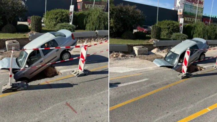 Automobil upao u rupu na cesti, stražnji dio ostao u zraku