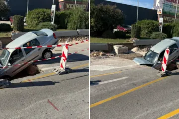 Automobil upao u rupu na cesti, stražnji dio ostao u zraku